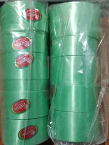 __ GREEN COLOUR SATIN PLASTIC CURLING RIBBONS 1 INCH MRP 25 RACK A4