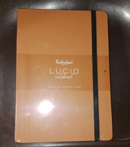 DIARY LUCID ORANGE COLOUR NOTEBOOK A5 (CODE LUC2-O) PAGES 160 MRP 220 RACK G2K3